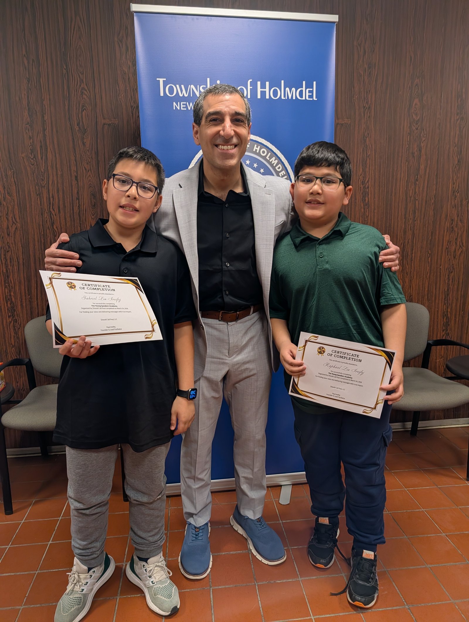 Young Speakers Academy students receiving certificates of completion